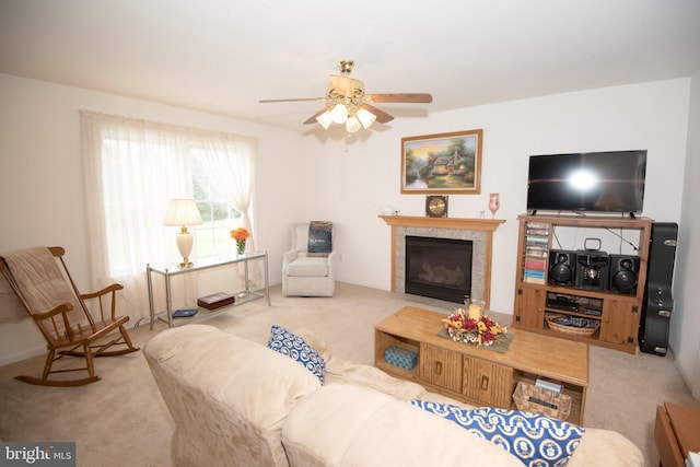 living room featuring light colored carpet and ceiling fan