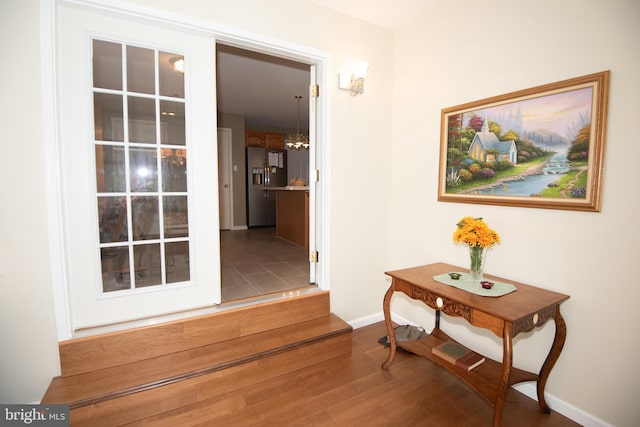 corridor featuring hardwood / wood-style floors