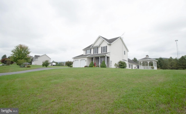 view of front of home featuring a gazebo and a front yard