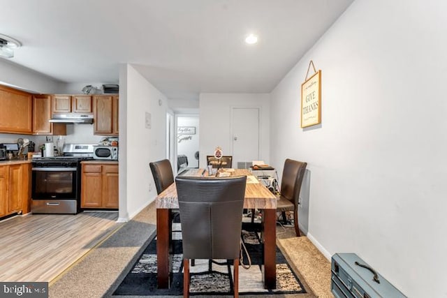 dining area with light wood-type flooring