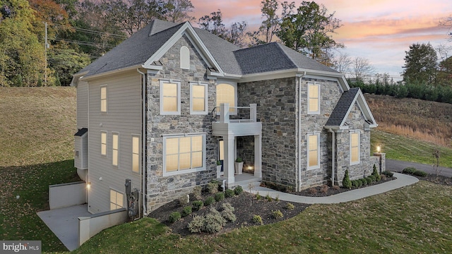 LOT16-CARLISLEAZALEA Bellflower Ln, Newtown Square, PA 19073 - view of front of home featuring stone siding, a balcony, a front yard, and a shingled roof