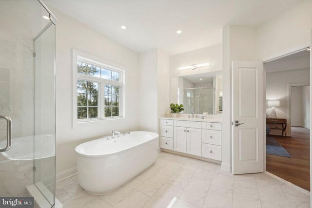 LOT16-CARLISLEAZALEA Bellflower Ln, Newtown Square, PA 19073 - full bath with marble look tile flooring, vanity, a shower stall, a soaking tub, and ensuite bath