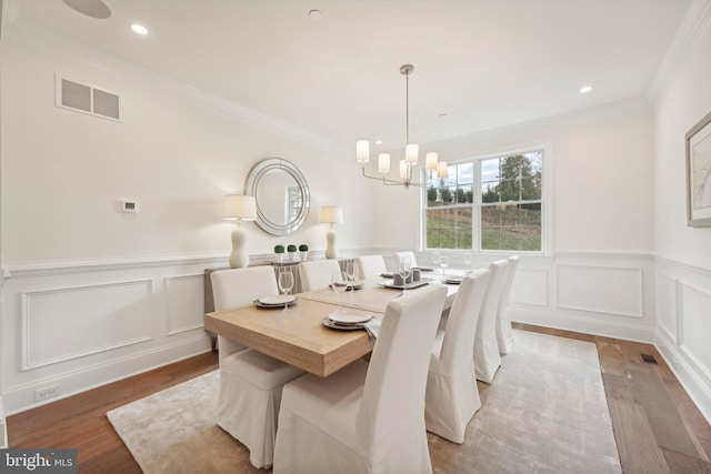LOT16-CARLISLEAZALEA Bellflower Ln, Newtown Square, PA 19073 - dining room featuring wood finished floors, a chandelier, a decorative wall, crown molding, and a wainscoted wall