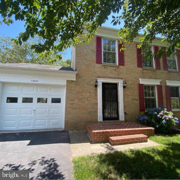 colonial home with a garage