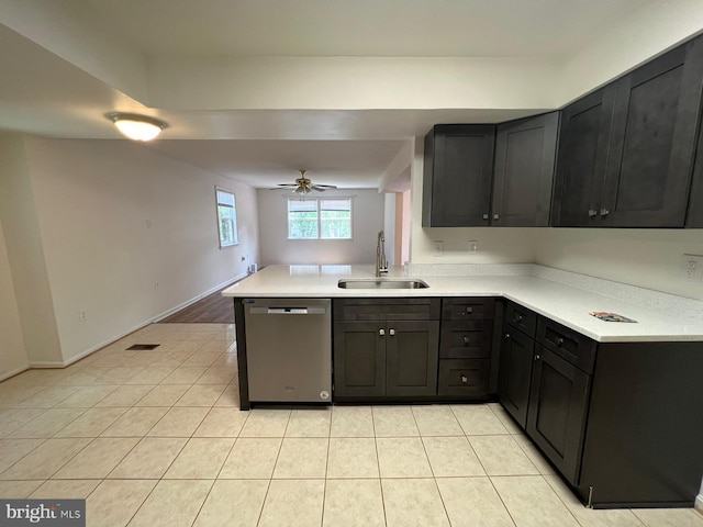 kitchen featuring dishwasher, ceiling fan, light tile patterned flooring, and sink