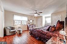 bedroom featuring hardwood / wood-style floors and ceiling fan