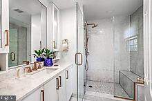 bathroom with vanity and walk in shower