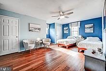 bedroom featuring hardwood / wood-style floors and ceiling fan