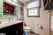 bathroom with vanity and toilet