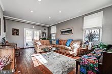 living room featuring dark hardwood / wood-style floors