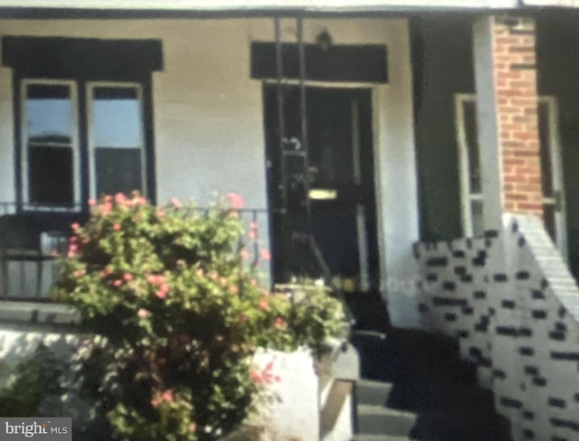 entrance to property with a porch