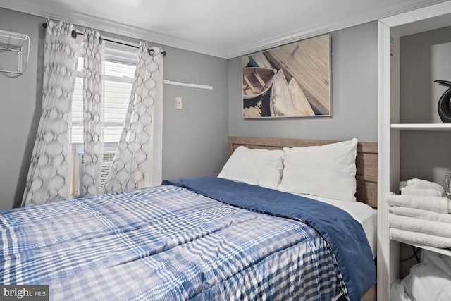 bedroom featuring crown molding