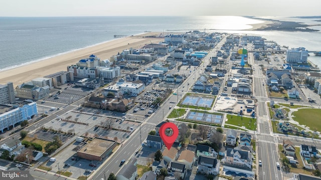 aerial view with a water view and a view of the beach