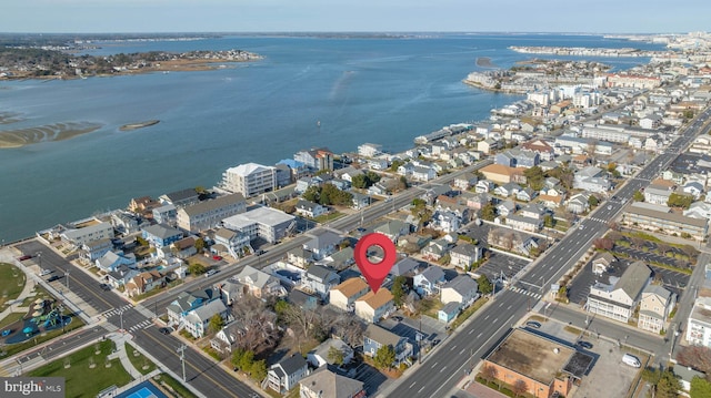 birds eye view of property featuring a water view