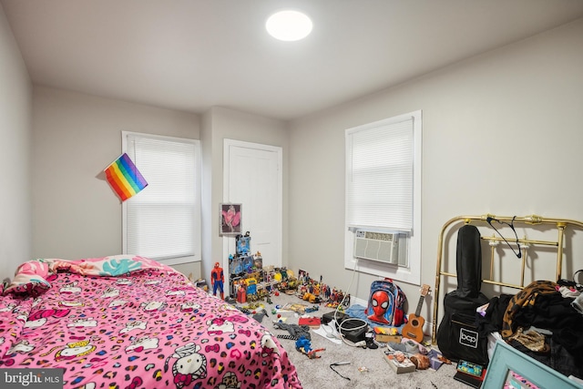 bedroom featuring carpet flooring and cooling unit