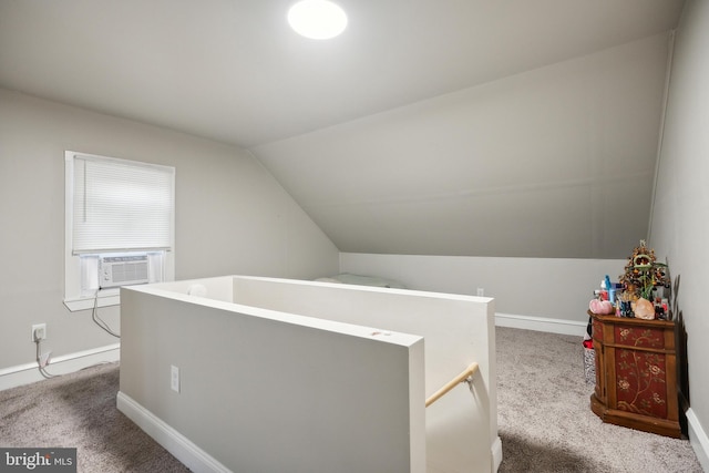 interior space featuring cooling unit and vaulted ceiling