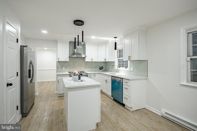 kitchen featuring stainless steel appliances, baseboard heating, white cabinets, a center island, and hanging light fixtures