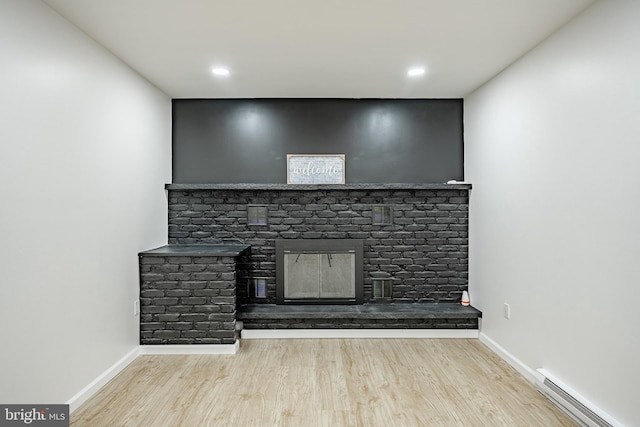 room details featuring hardwood / wood-style floors and a baseboard radiator