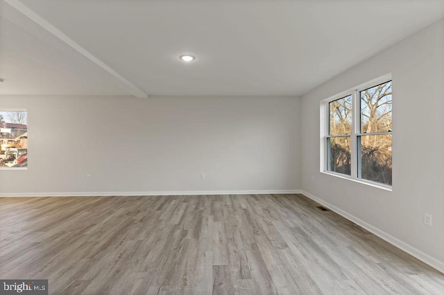 unfurnished room with light hardwood / wood-style flooring