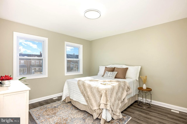 bedroom featuring dark hardwood / wood-style flooring