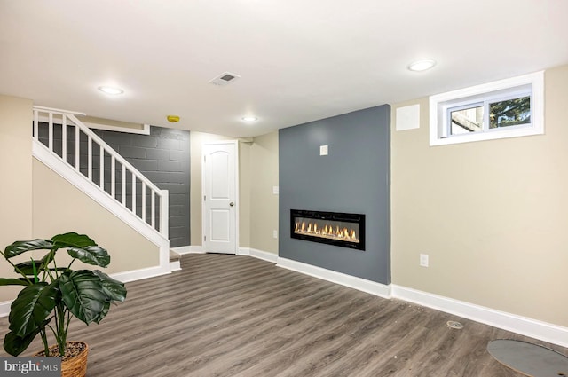 basement with dark wood-type flooring