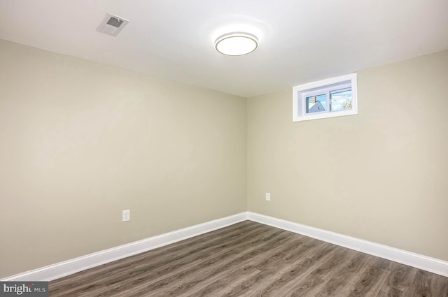 basement with dark wood-type flooring