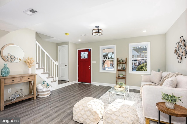 living room with dark hardwood / wood-style flooring