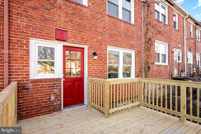 entrance to property with a wooden deck