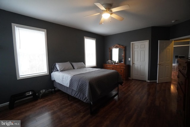 bedroom featuring dark wood-type flooring and ceiling fan