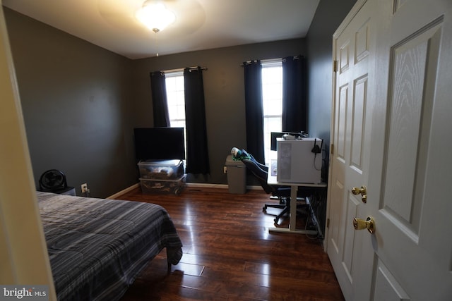 bedroom featuring dark hardwood / wood-style flooring