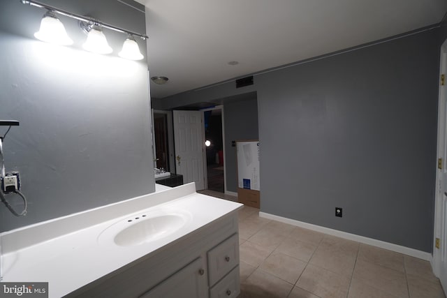 bathroom with tile patterned flooring and sink