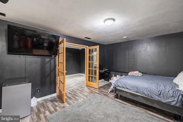 bedroom with hardwood / wood-style flooring