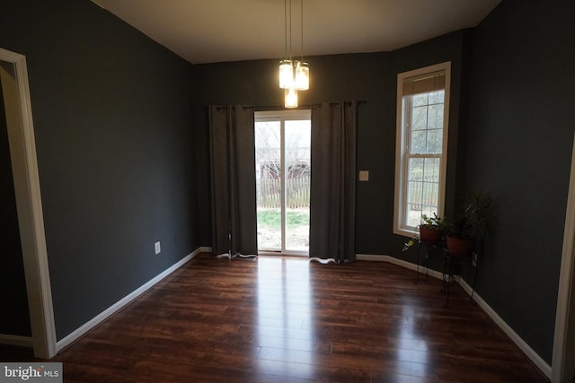 spare room featuring dark hardwood / wood-style floors