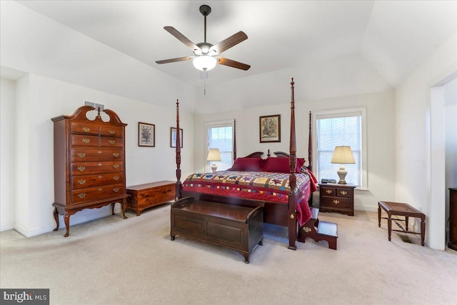 bedroom with light colored carpet, ceiling fan, and lofted ceiling