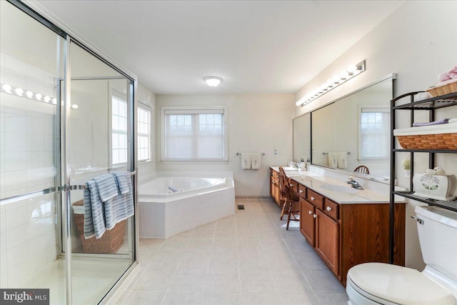 full bathroom with toilet, shower with separate bathtub, vanity, and tile patterned floors