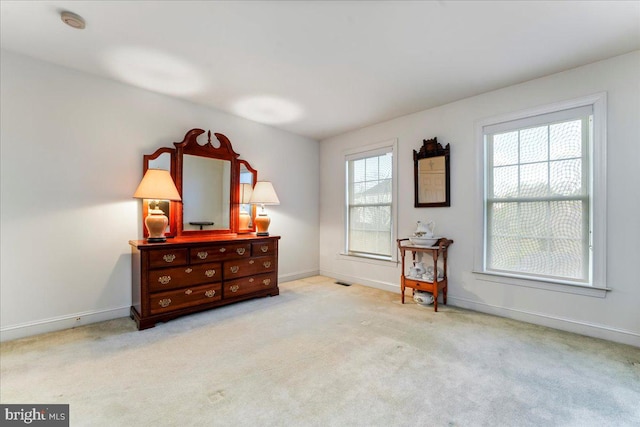 interior space featuring light colored carpet