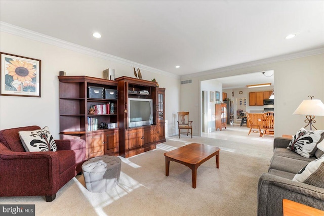 living room with light carpet and ornamental molding