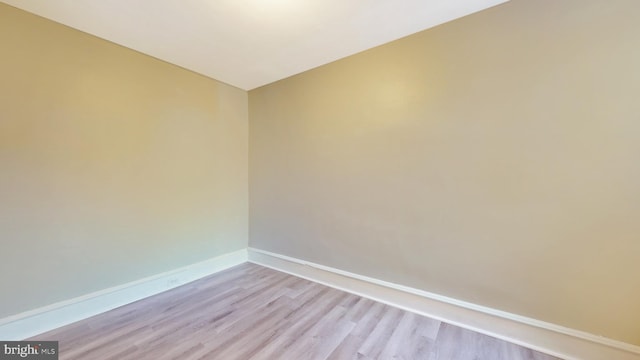 empty room with light hardwood / wood-style floors