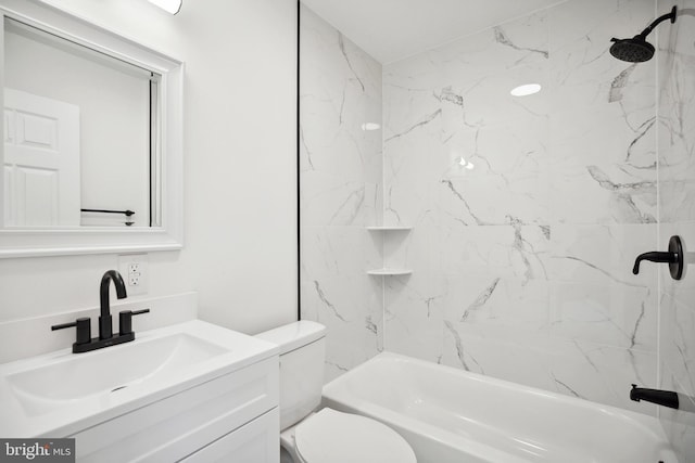 full bathroom featuring vanity, toilet, and tiled shower / bath