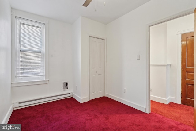 unfurnished bedroom featuring baseboard heating, ceiling fan, and carpet flooring