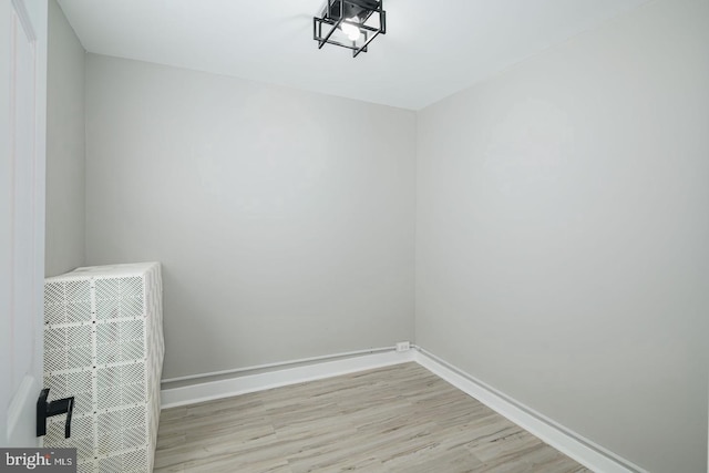 spare room with light hardwood / wood-style flooring