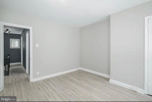 spare room featuring light hardwood / wood-style floors