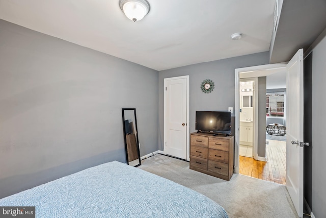 bedroom with light carpet