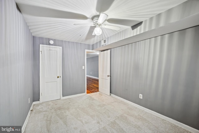 unfurnished bedroom with carpet and ceiling fan