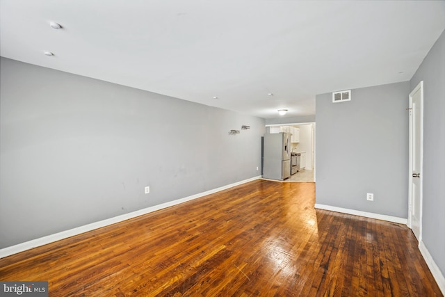 empty room featuring wood-type flooring