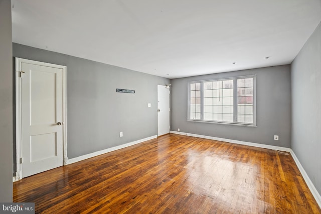 empty room featuring wood-type flooring