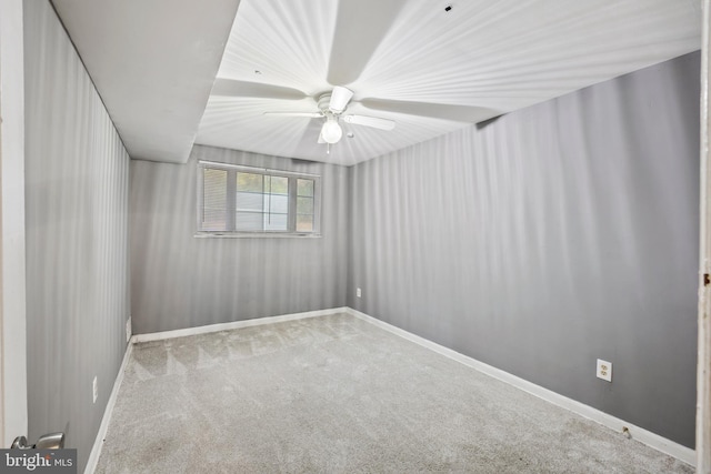 unfurnished room featuring light carpet and ceiling fan