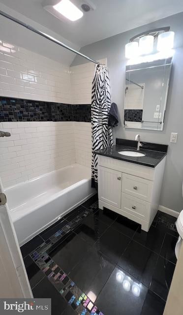 full bathroom with tile patterned flooring, vanity, toilet, and shower / bath combo with shower curtain