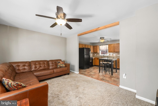 living room with light carpet and ceiling fan