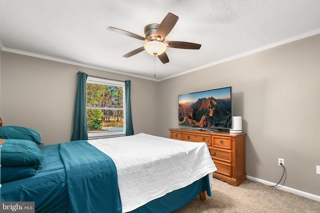 carpeted bedroom with ceiling fan, crown molding, and a textured ceiling